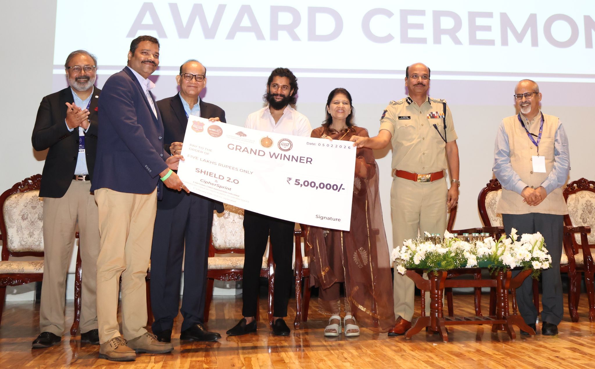 QUPASS receiving the SHIELD 2026 Grand Winner prize of five lakh rupees on stage